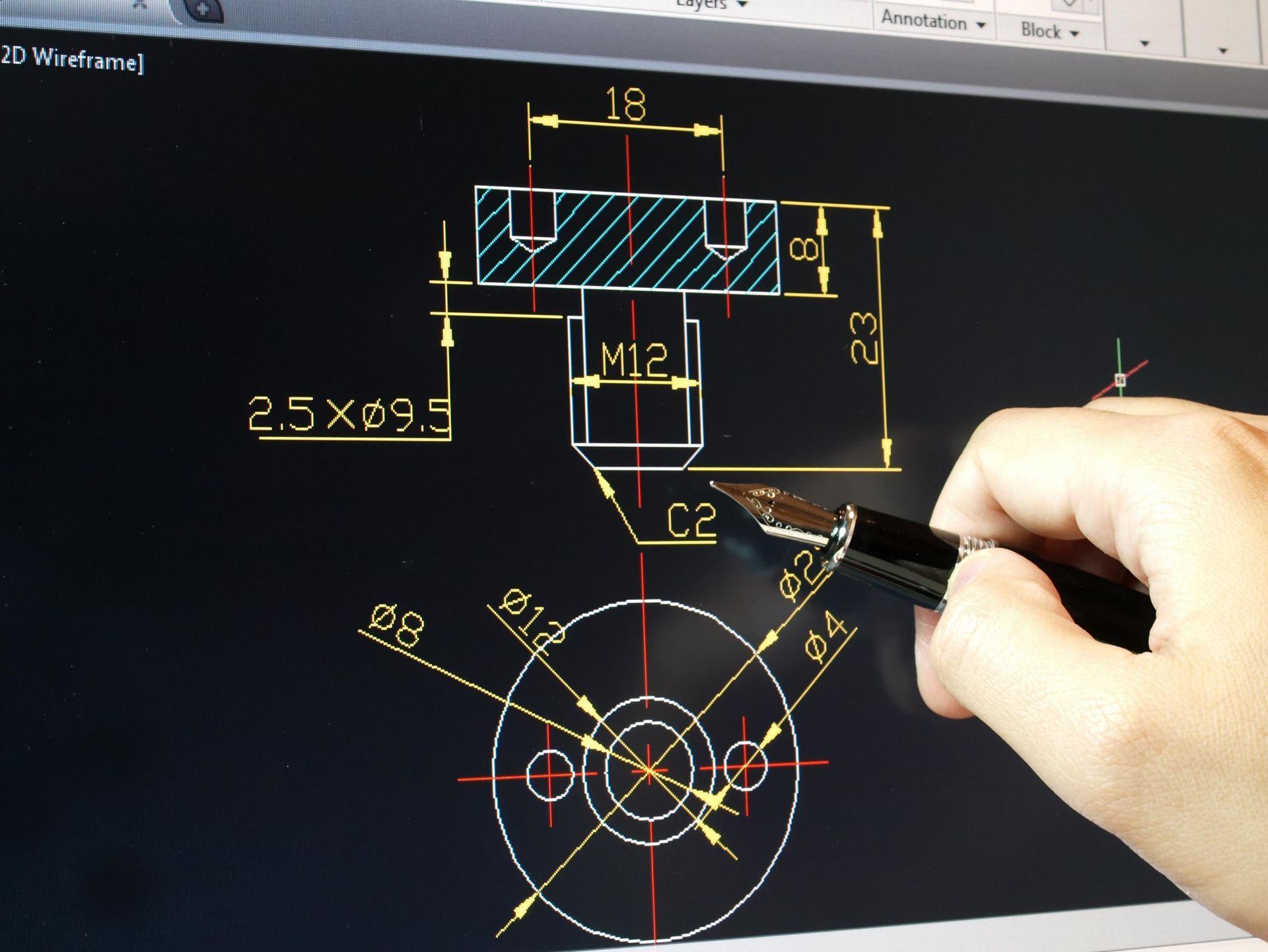 Hand drawing on a technical CAD-style blueprint with circular mechanical diagram and dimension labels