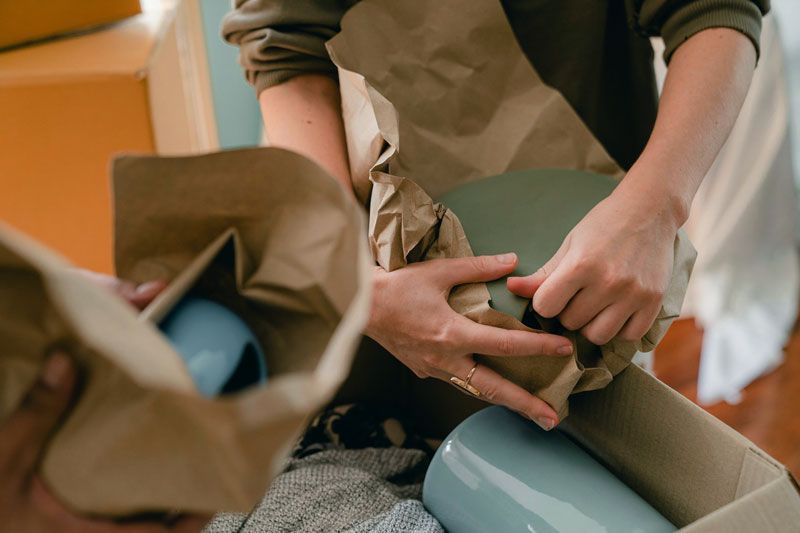 person creating pottery