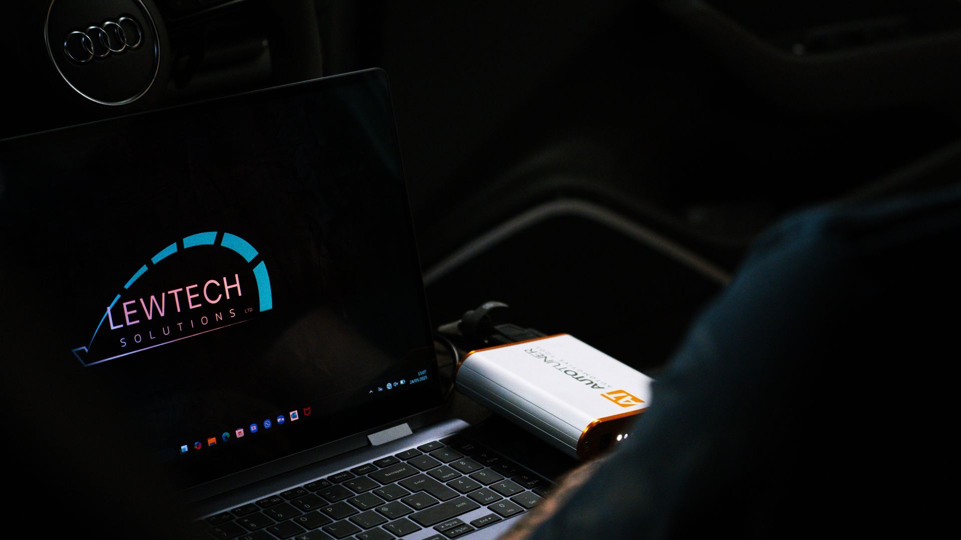 Laptop connected to a vehicle for ECU remapping and diagnostics
