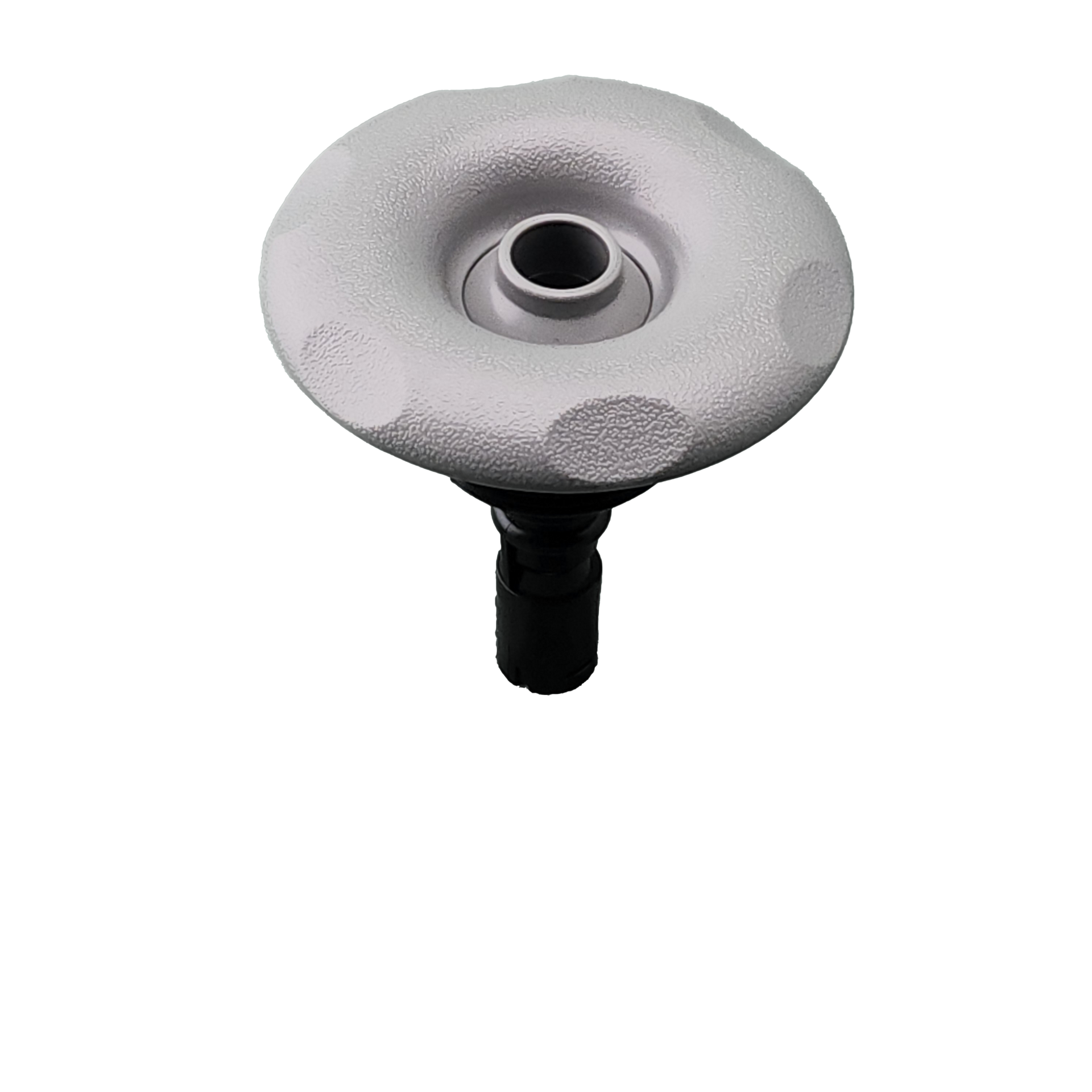 A close up of spa jet on a white background.