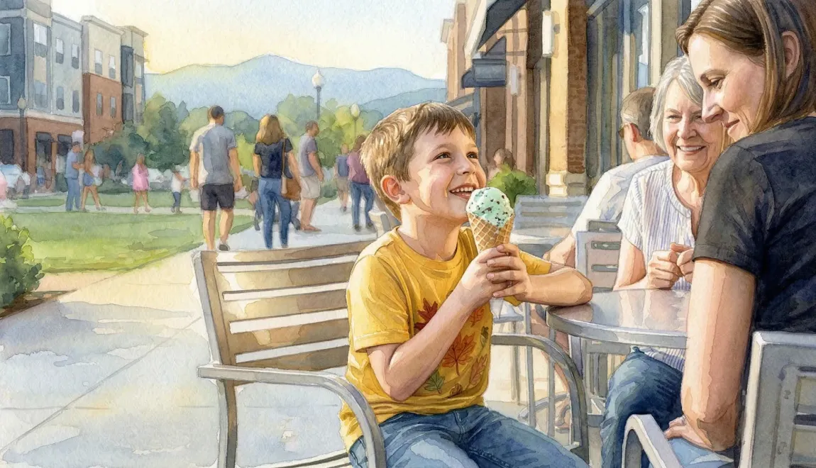 People sitting at an outdoor café, sharing ice cream and smiling in a sunny park setting