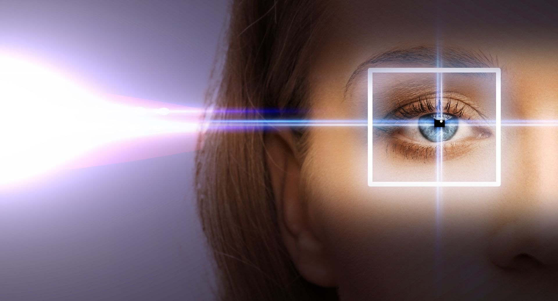 A woman 's eye is being scanned by a laser beam.