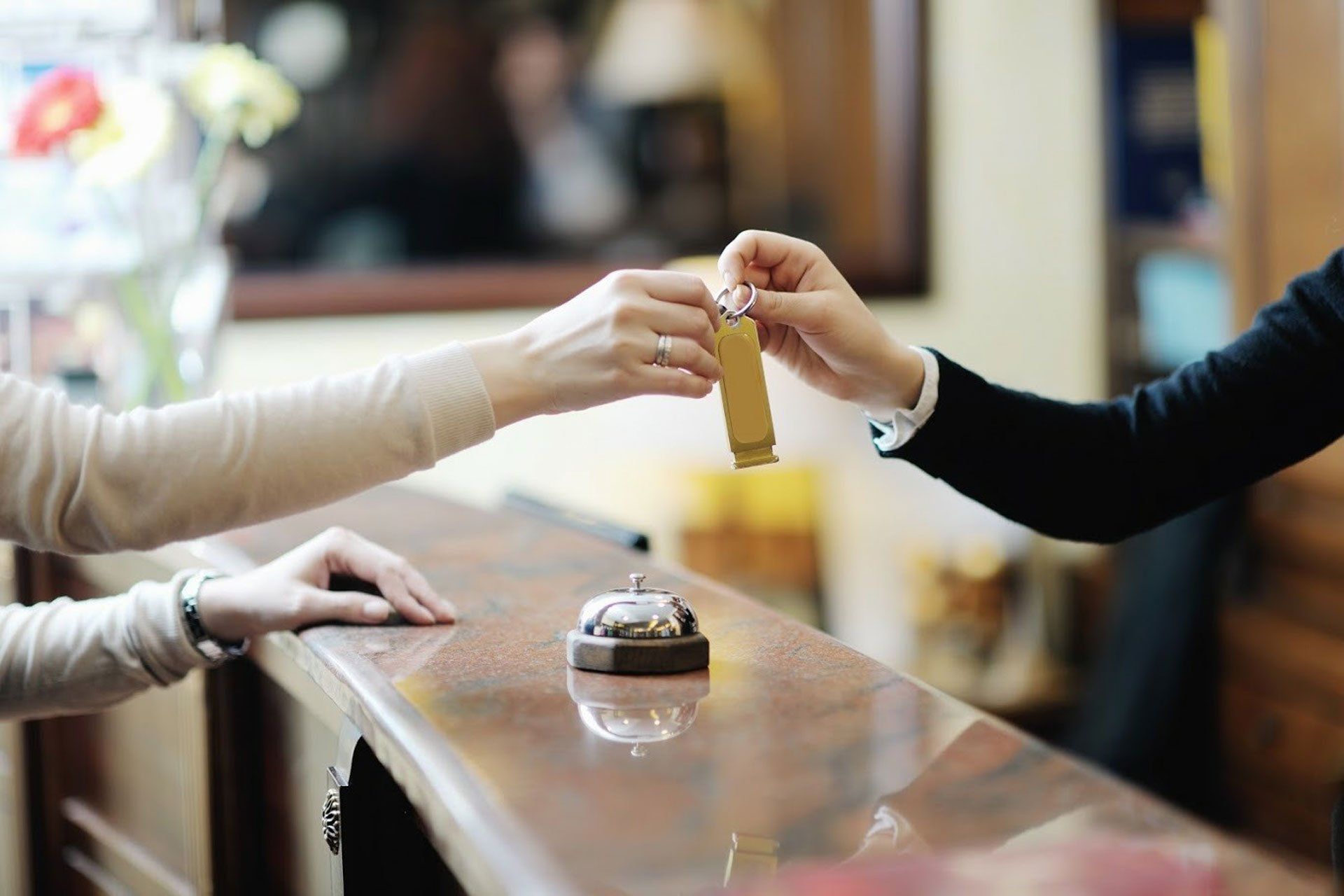 Woman Recieving Hotel Key — Phoenix, AZ — Phoenix Access Control Woman Recieving Hotel Key — Phoenix, AZ — Phoenix Access Control