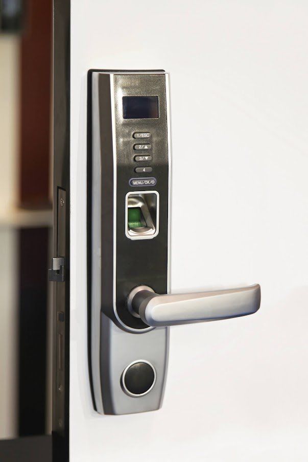 A close up of a fingerprint lock on a door.