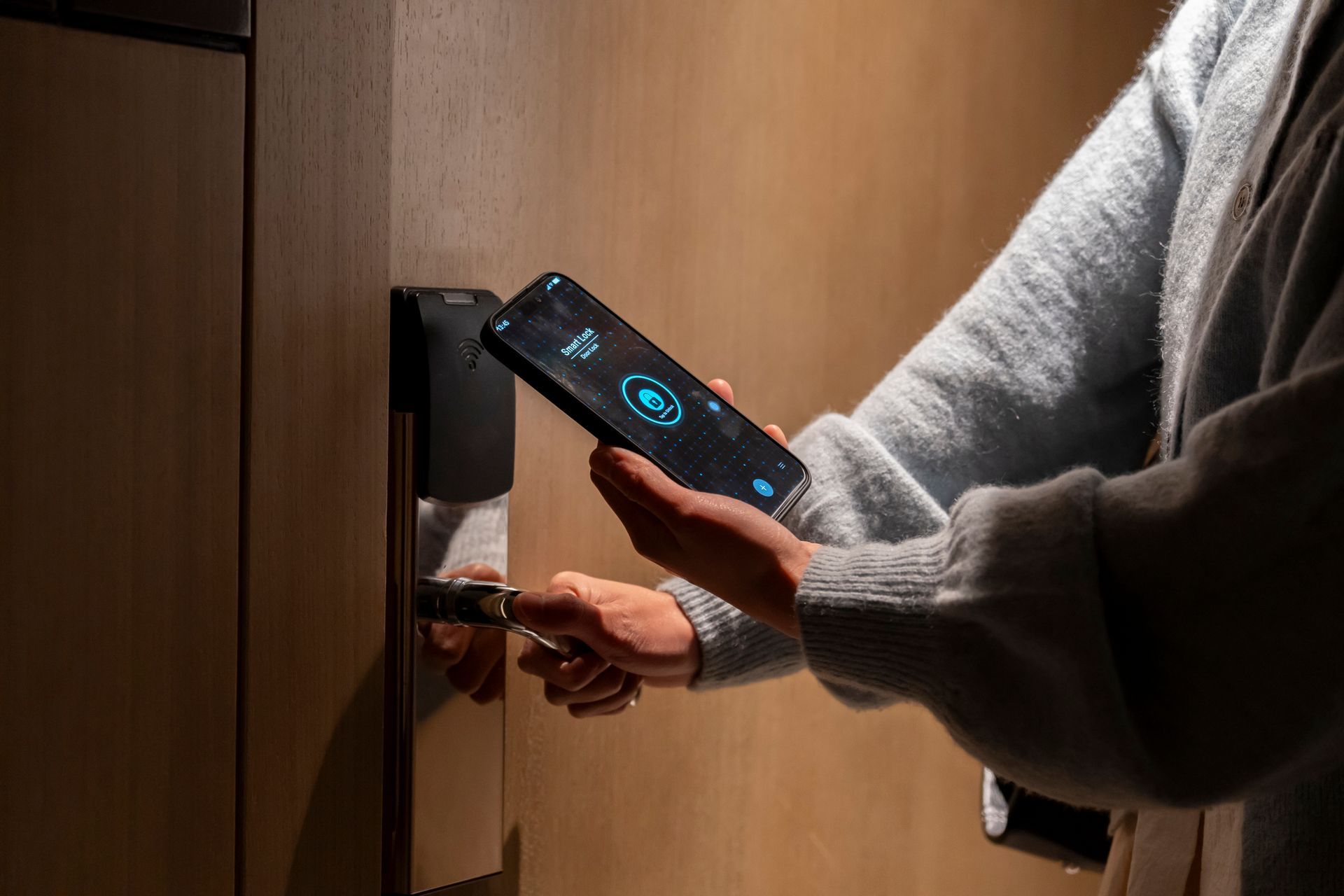 Women unlock rooms with mobile phones.