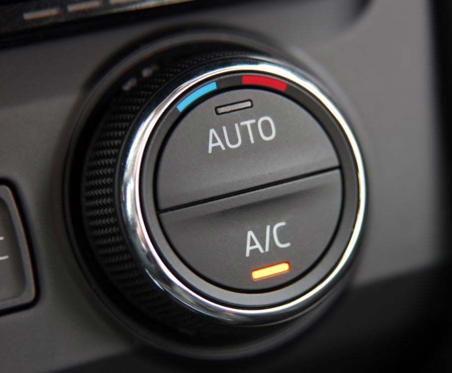 Car climate control knob with AUTO and A/C labels, accented in red, blue, and orange.