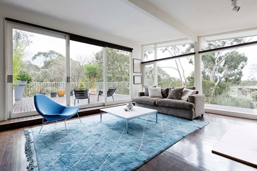 Modern Living Room With Floor-to-ceiling Windows, Blue Rug, Blue Chair — All Aussie Sunrooms in Port Stephens, NSW