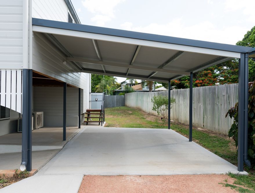 A Steel Carport with Concrete Pad Attached to a Cottage — All Aussie Sunrooms in Port Stephens, NSW