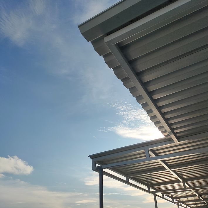 A Grey Colorbond Awning Covering a Large Outdoor Space — All Aussie Sunrooms in Port Stephens, NSW