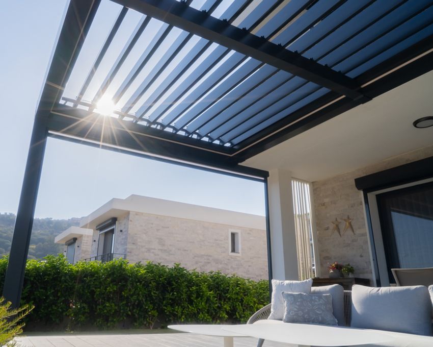 A Steel Pergola Covering an Outdoor Living Area — All Aussie Sunrooms in Port Stephens, NSW