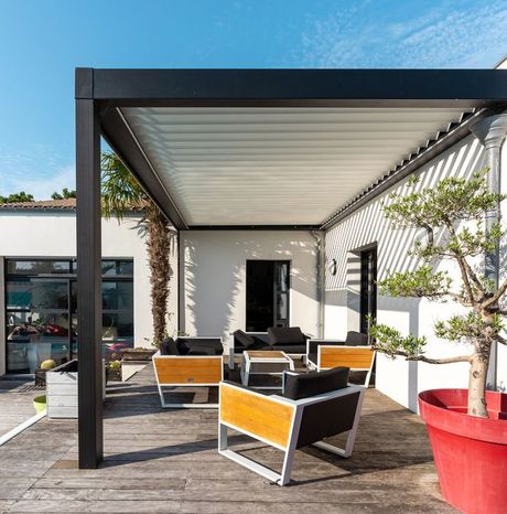 Modern Patio Pergola With Seating and Table in an Outdoor Garden — All Aussie Sunrooms in Port Stephens, NSW