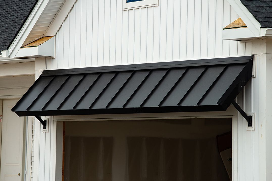 A Black Aluminium Awning on a White Wooden House — All Aussie Sunrooms in Port Stephens, NSW
