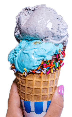 A two-scoop ice cream cone, blue and grey, topped with colorful sprinkles, held in a hand.