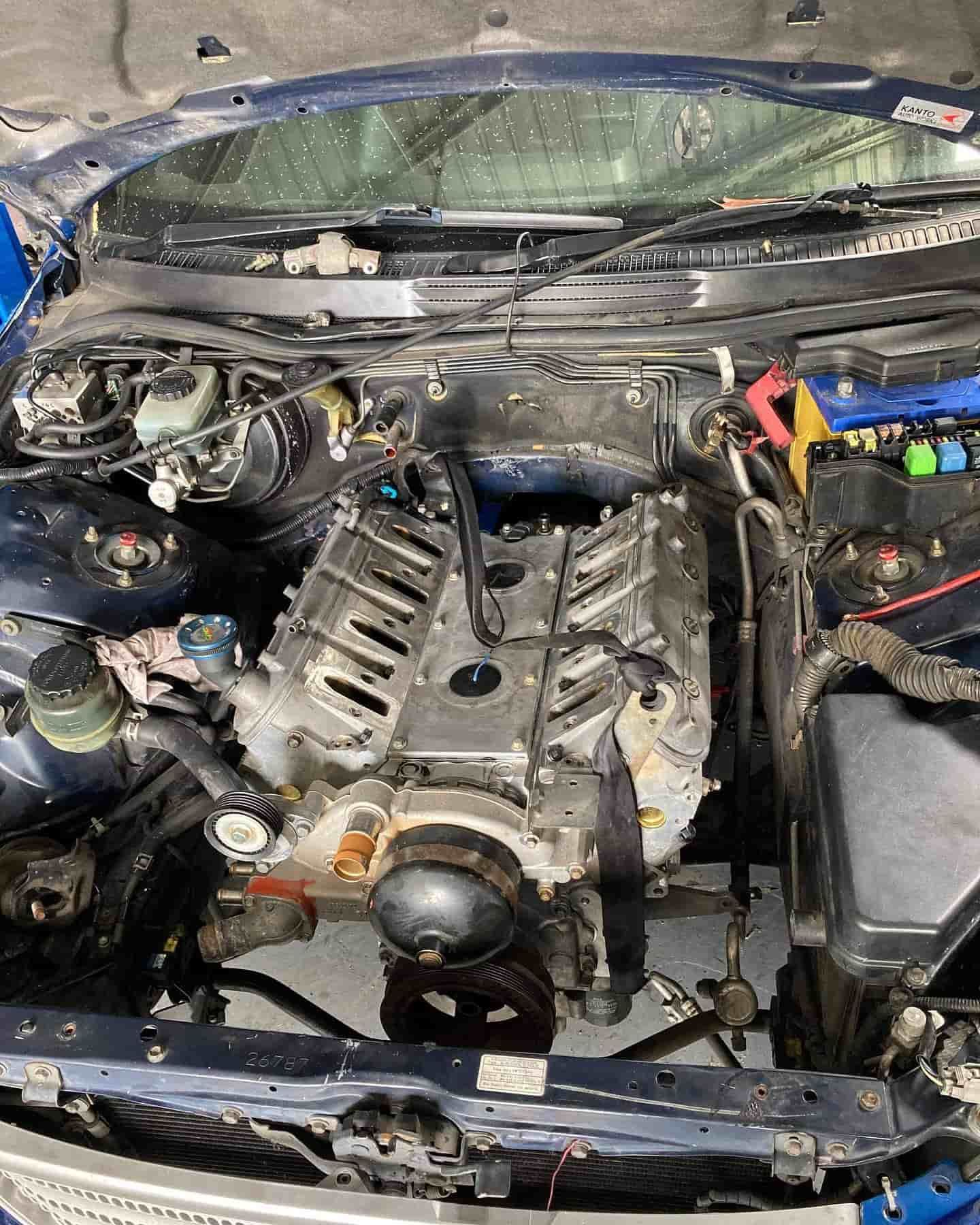 A Close Up Of A Car Engine With The Hood Open — ProStreet Automotive & Fabrication In Cardiff, NSW