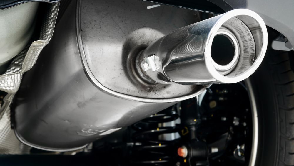A Close Up Of A Car Exhaust Pipe On The Back Of A Car — ProStreet Automotive & Fabrication In Cardiff, NSW