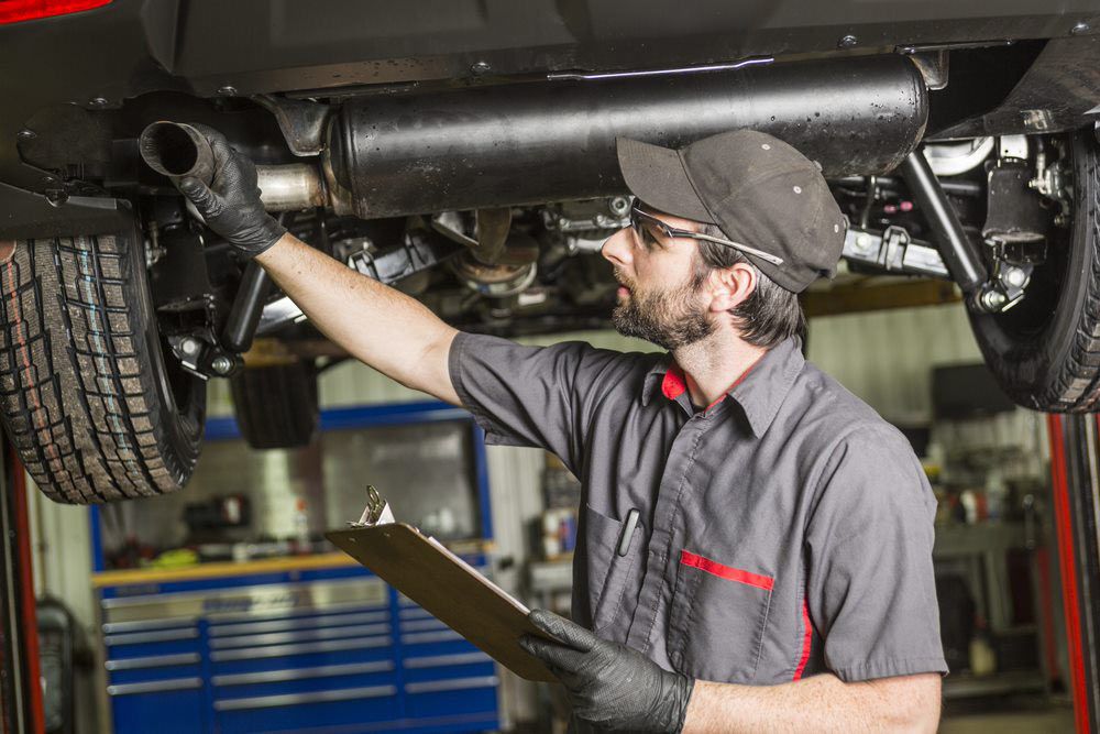 Mechanic Checking the Muffler — About Us in Kempsey, NSW