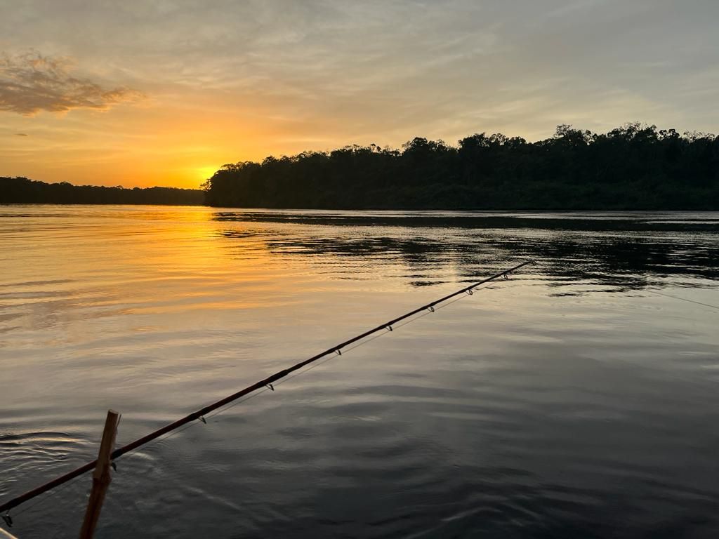 Sunset view over remote Amazon River fishing destination