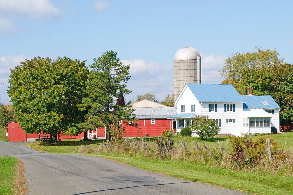 A large house with a fire hydrant in front of it