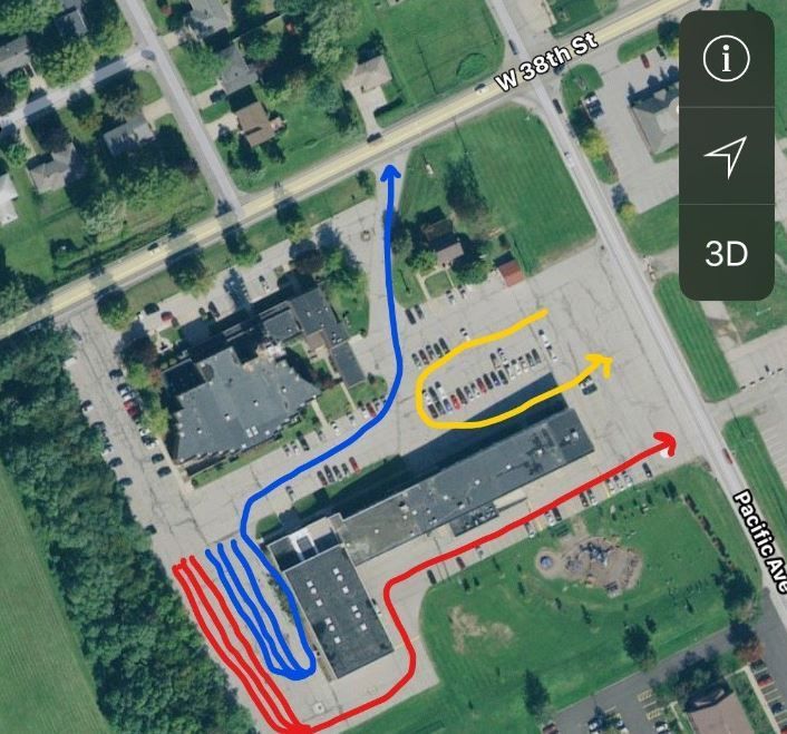 An aerial view of a school with arrows pointing to different directions