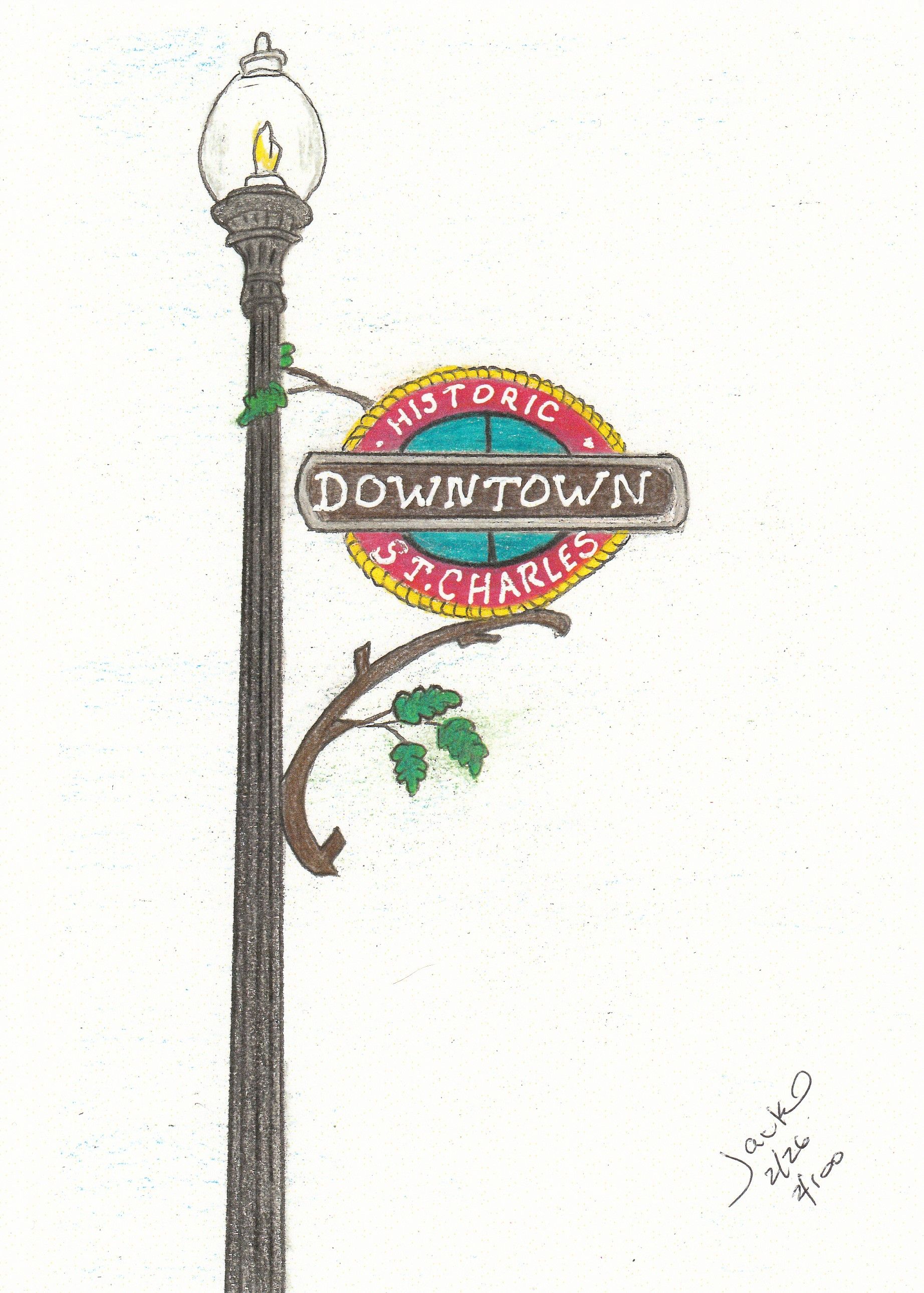 Victorian-style street lamp with a colorful circular “Downtown Historic” sign on a white background