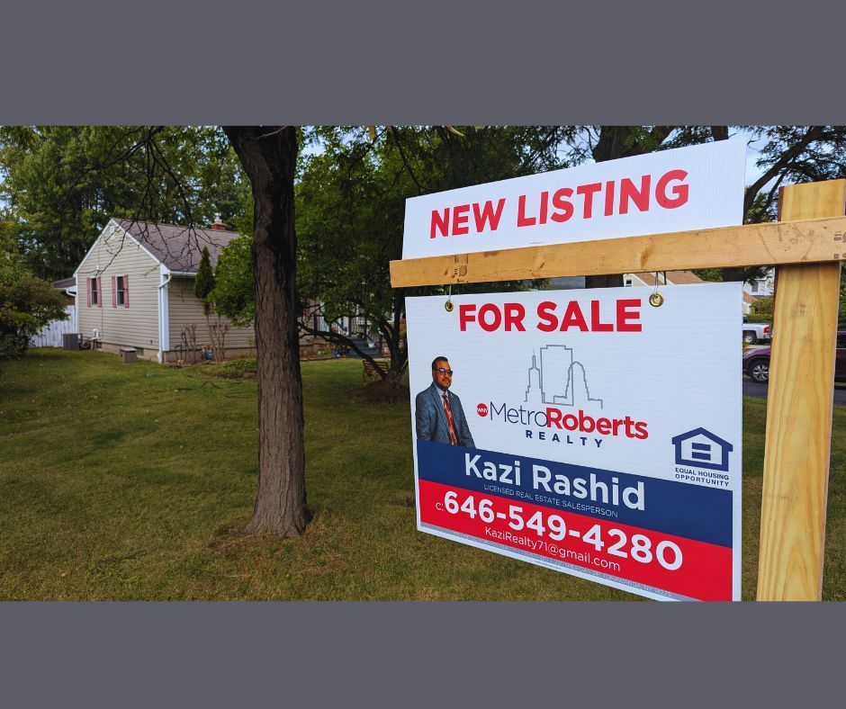 Real estate sign in front of a house: 