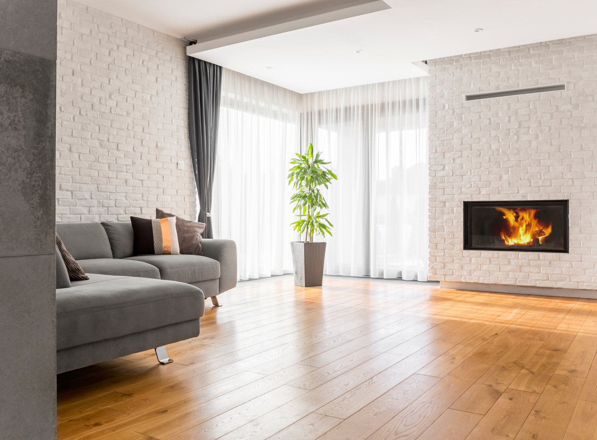 A living room with a fireplace and a couch.