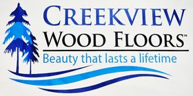 A logo for creekview wood floors beauty that lasts a lifetime