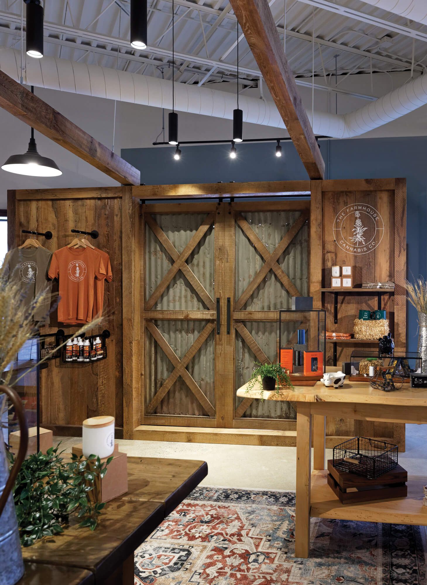 A store with wooden walls and sliding barn doors.