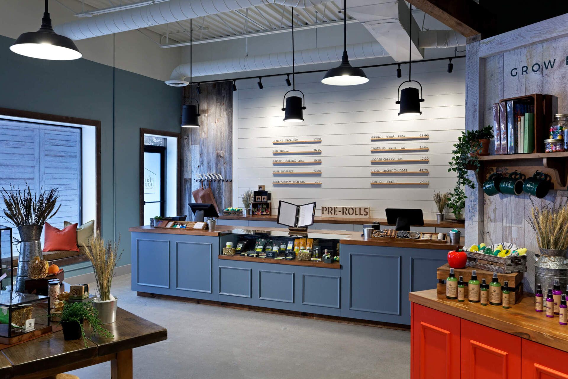 A store with blue cabinets and red cabinets and a counter.