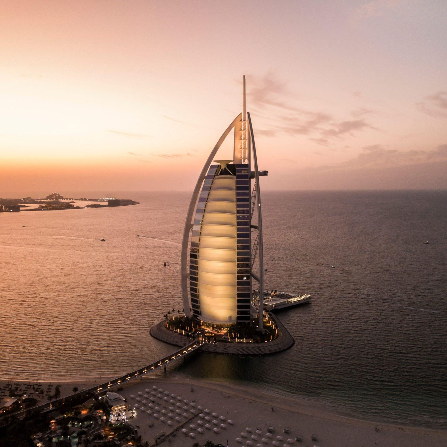 An aerial view of the burj khalifa at sunset