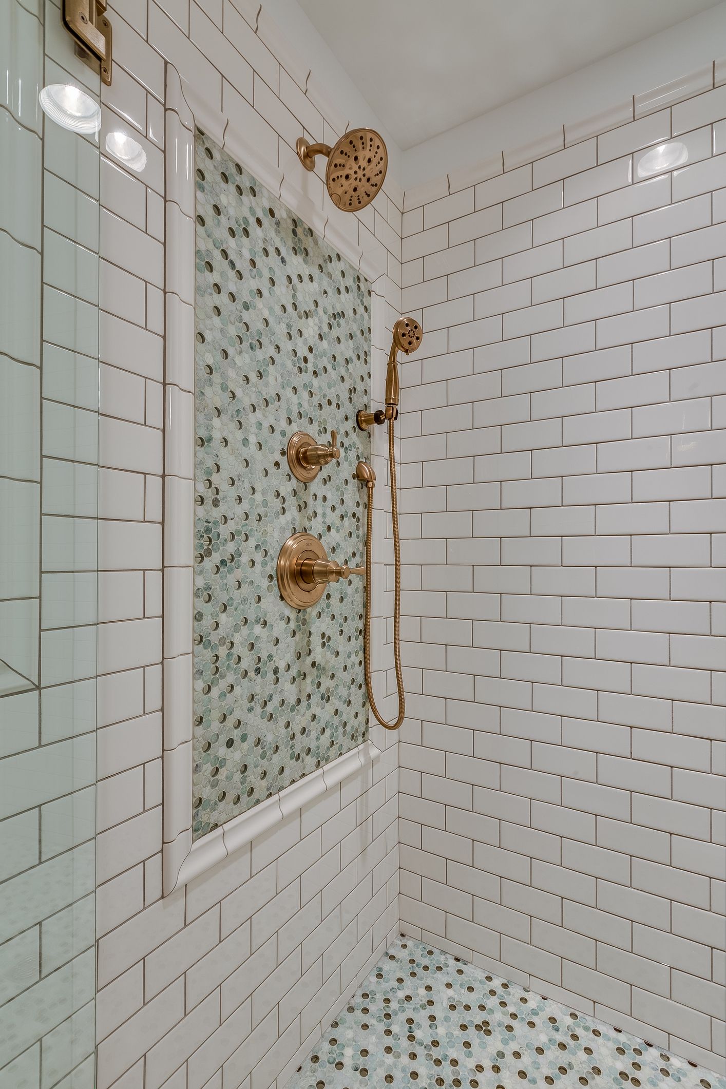 Gray speckled tile wall with a grid of dark grout lines