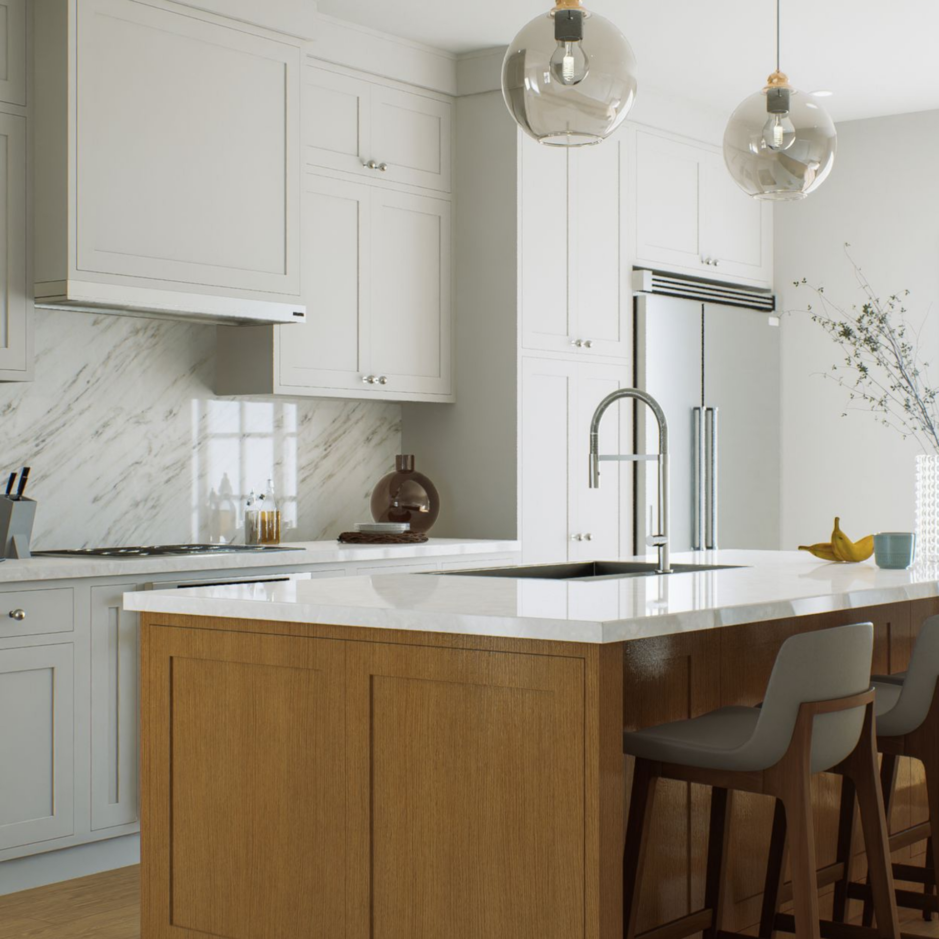 Modern white kitchen with marble island, wood cabinetry, and pendant lights