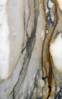 White marble surface with gray and gold veining