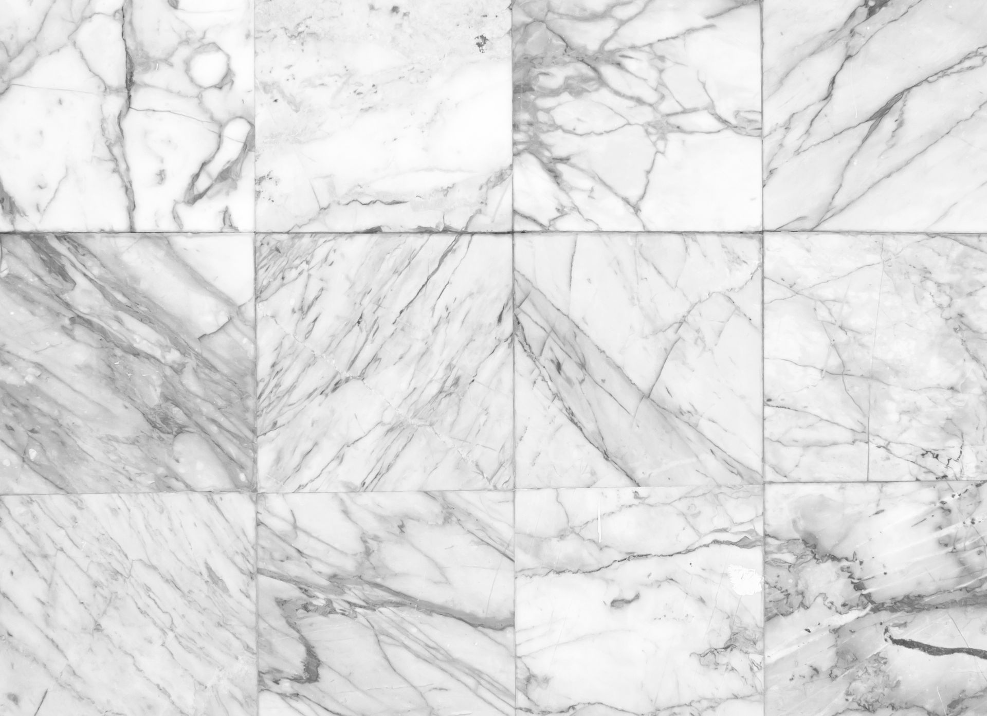 White marble tile pattern with gray veining in a grid layout