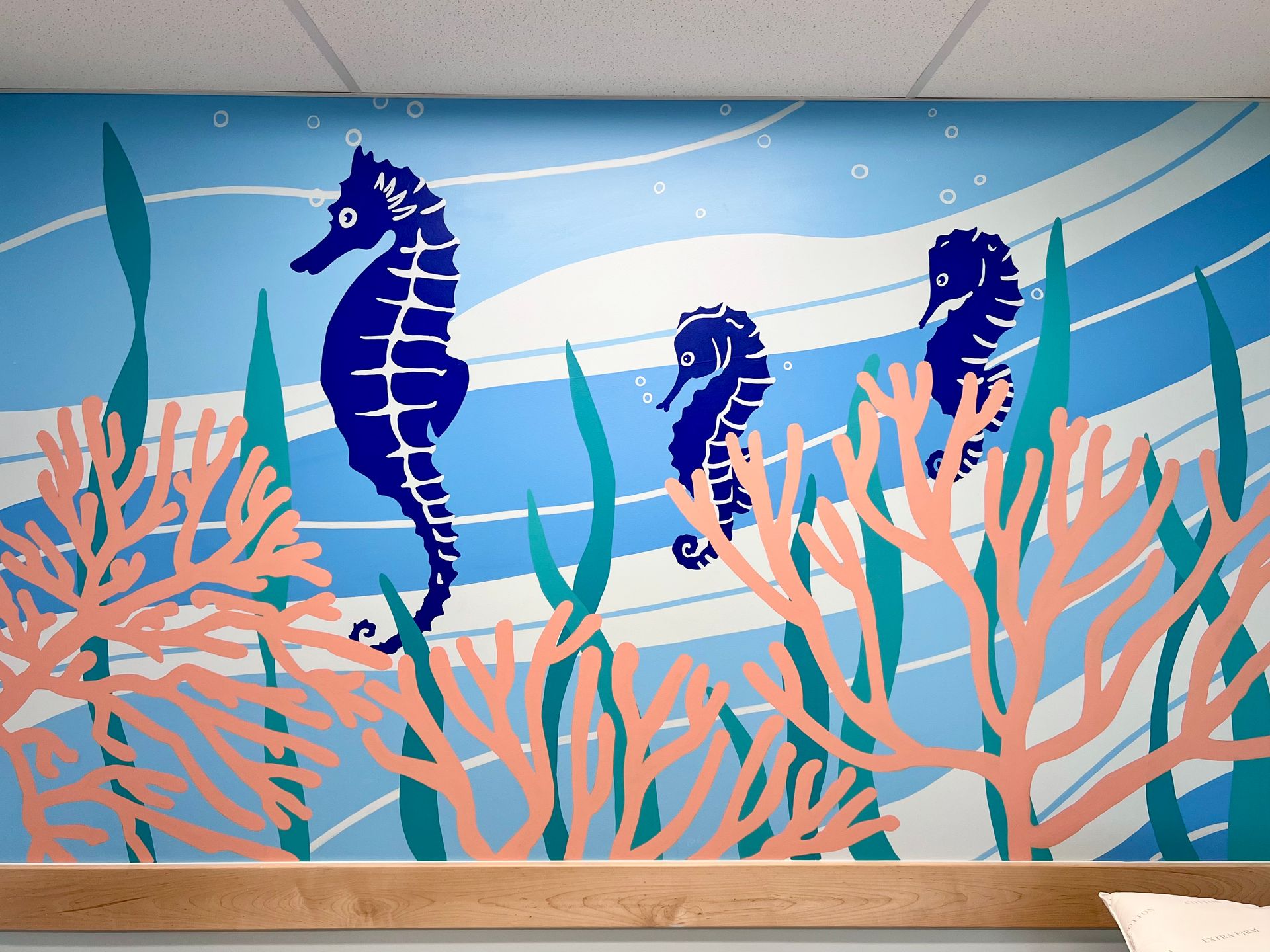 Seahorse and coral mural in a pediatric exam room, Austin