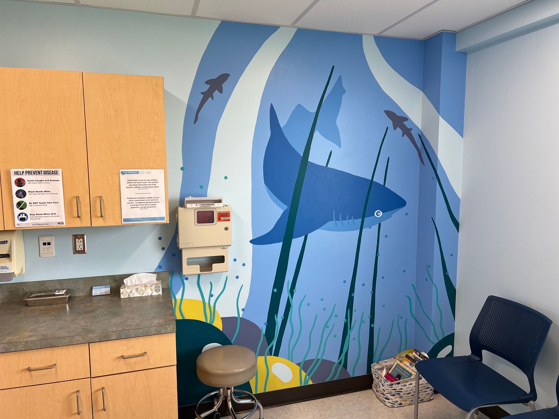 Friendly shark mural in a pediatric exam room at Dell Children's, Austin