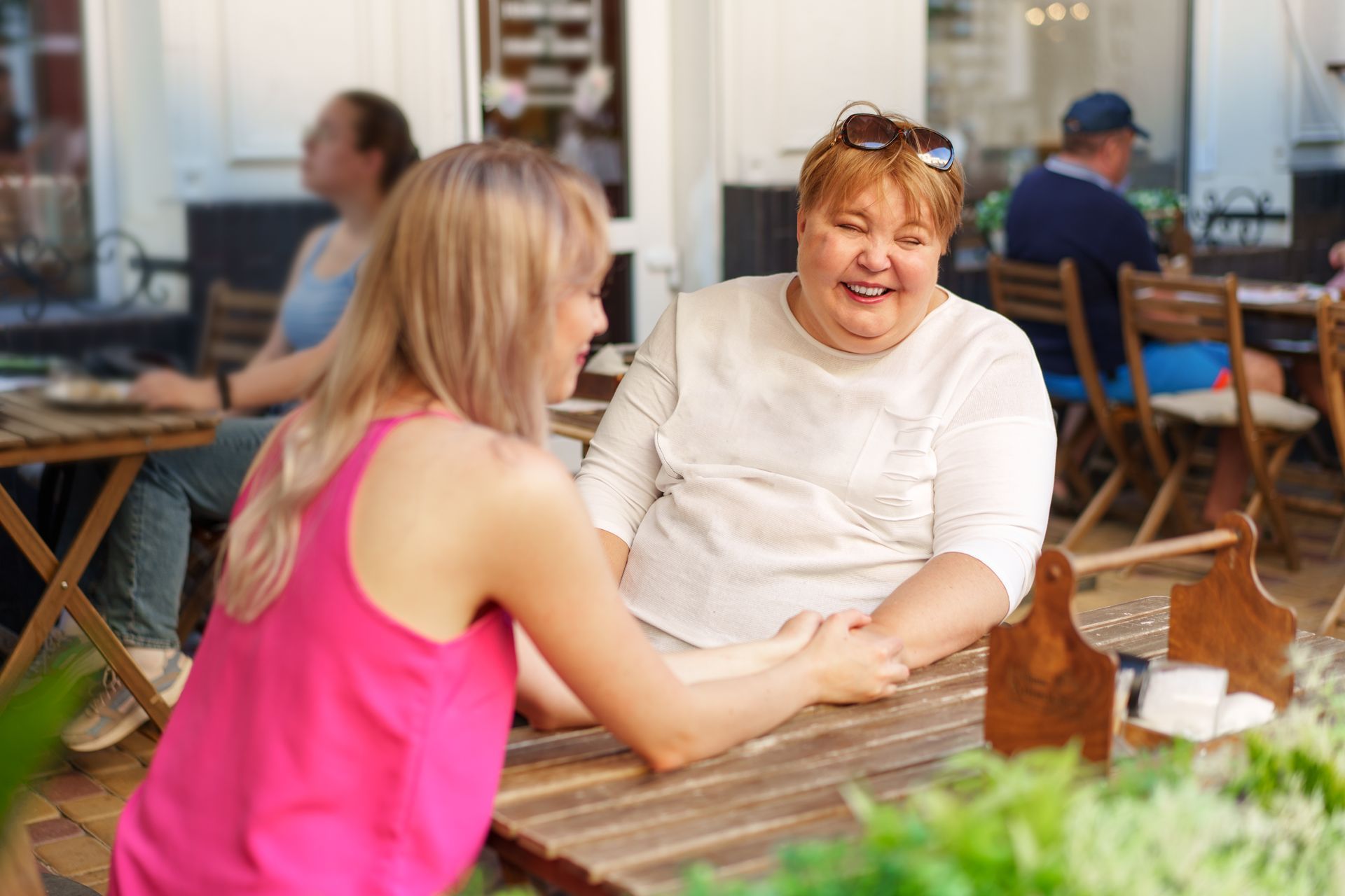 A woman using a wheelchair talking with a support worker at home