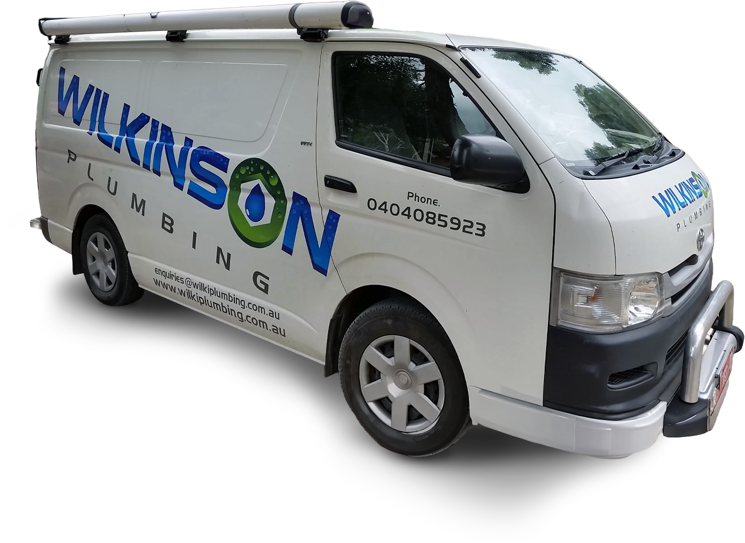 White Wilkinson Plumbing van parked outdoors with company logo.