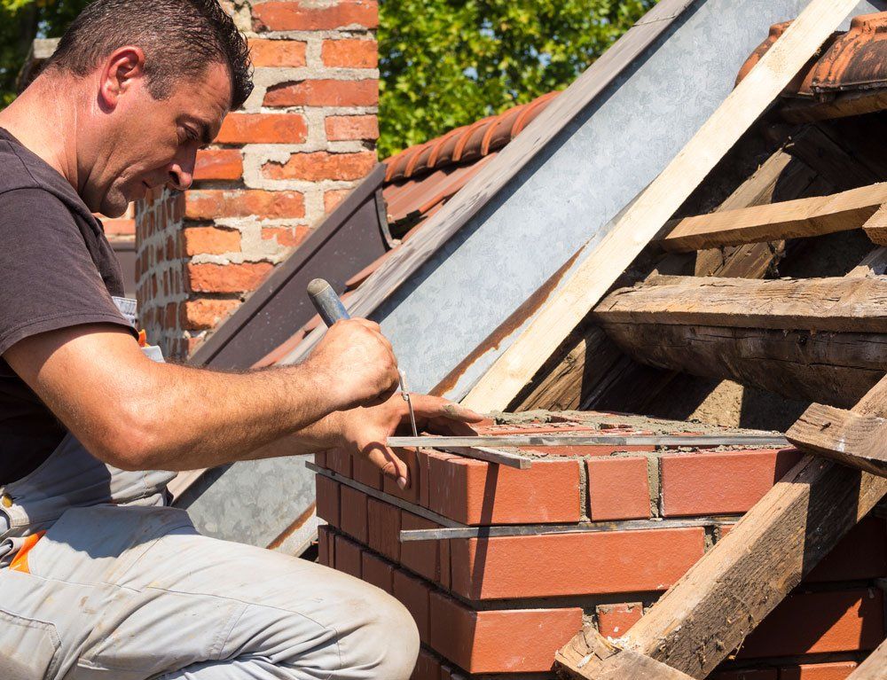 Working On Brick Chimney — Newburg, WI — Laubenstein Inc