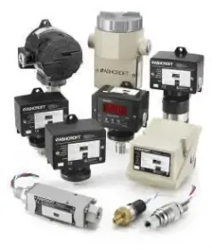 Assorted industrial sensors and control devices in black, white, and metallic housings on a white background