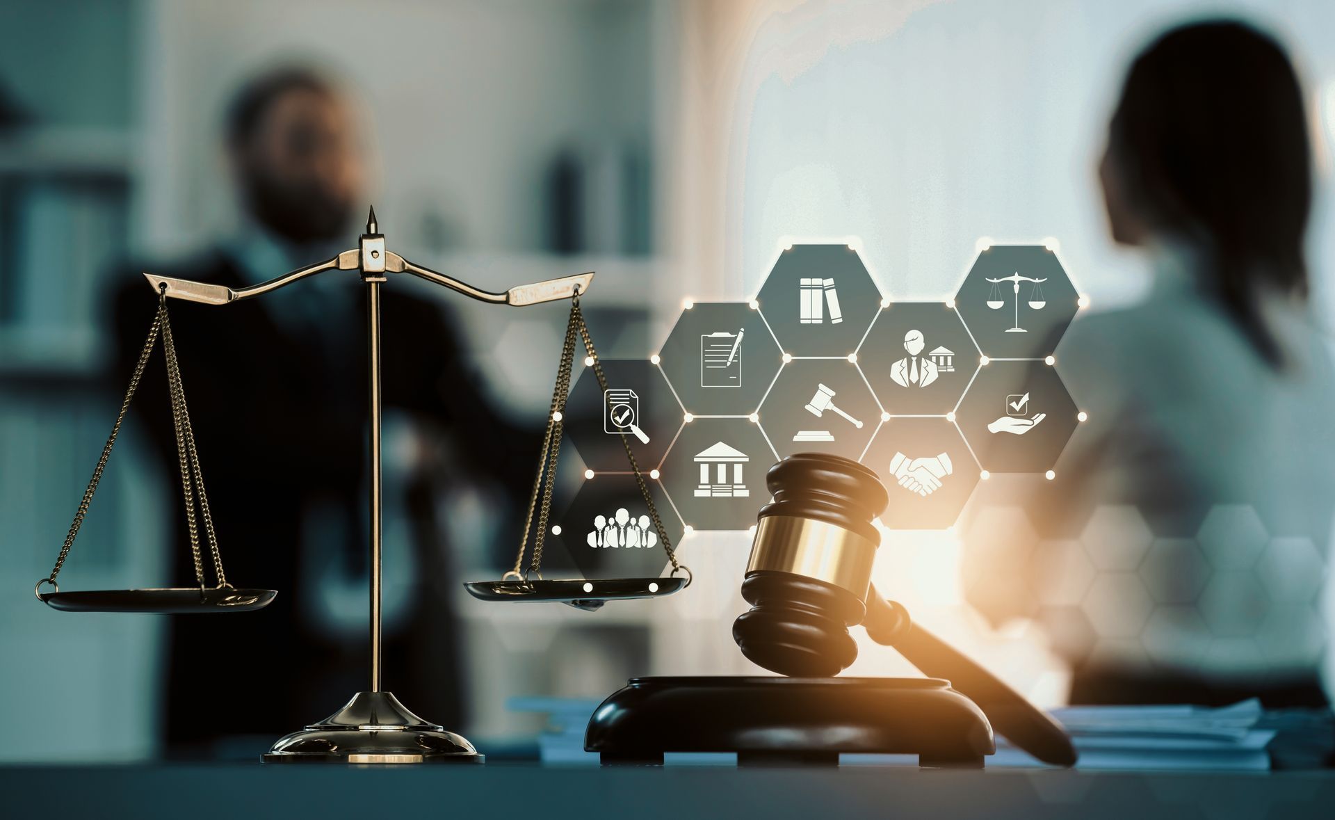a judge 's gavel and scales of justice are on a table .