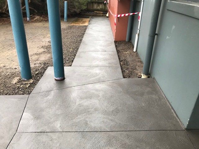 Concrete walkway in front of the house