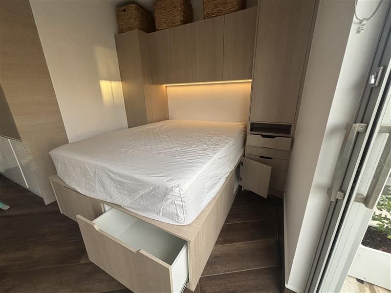Modern bedroom with a built-in bed and overhead cabinets — Piscopo Kitchens Plus In Forster, NSW