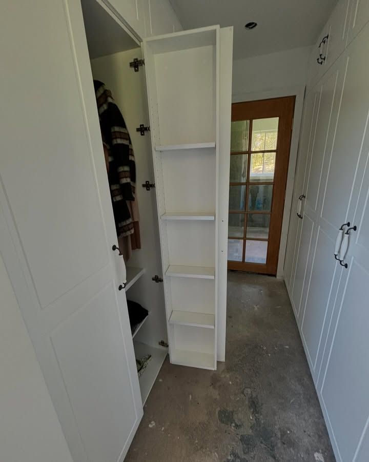 Narrow Hallway Closet With White Shelves and Open Doors— Piscopo Kitchens Plus In Forster, NSW