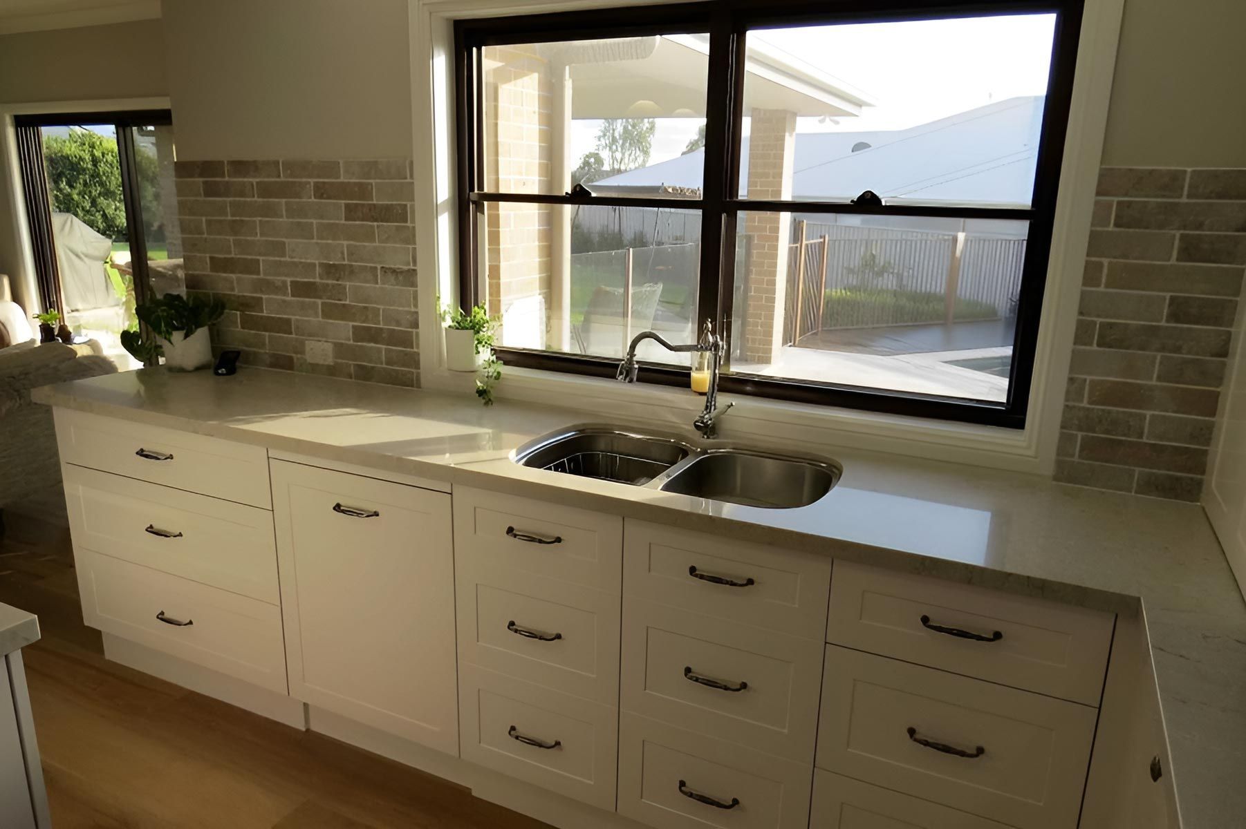 Kitchen With White Cabinets and Dual Sink — Piscopo Kitchens Plus In Tuncurry, NSW.