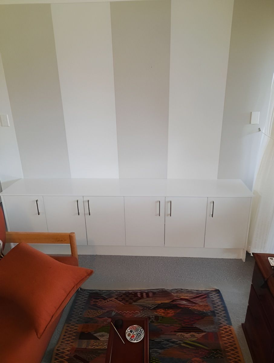 A Cozy Living Room Corner With a White Cabinet — Piscopo Kitchens Plus In Forster, NSW