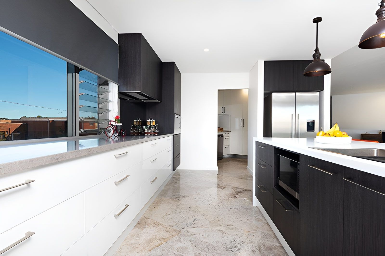 Kitchen With Black and White Cabinetry and a Large Window — Piscopo Kitchens Plus In Old Bar, NSW