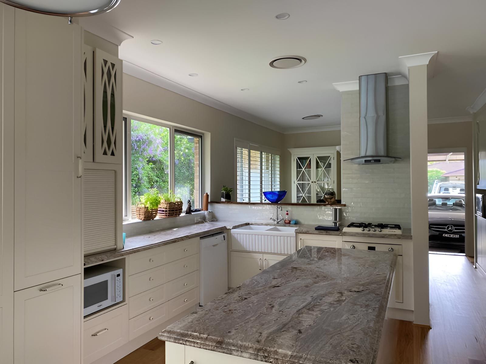 Modern Kitchen With a Marble Island — Piscopo Kitchens Plus In Forster, NSW