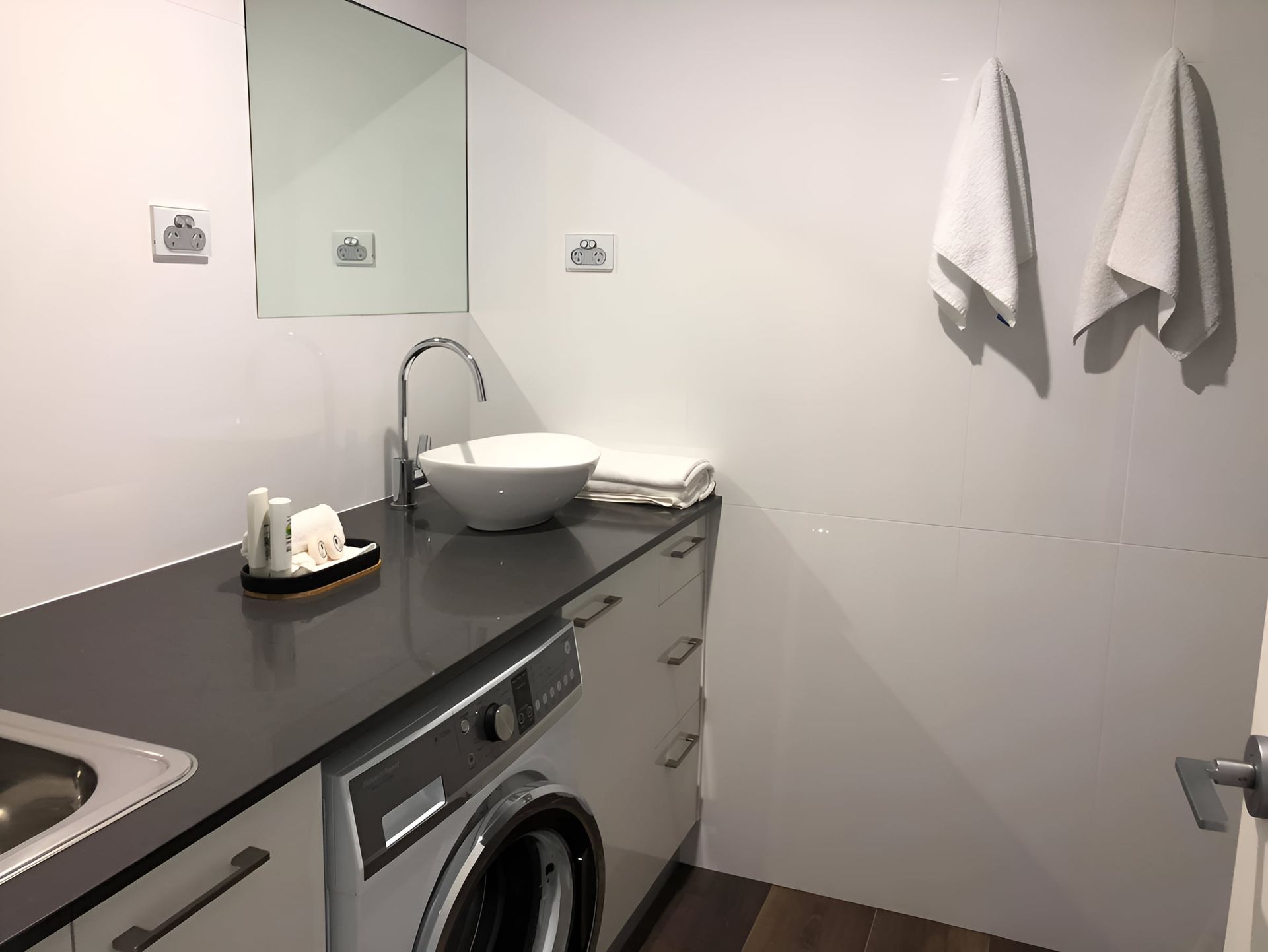 Bathroom With a White Bowl Sink and Faucet — Piscopo Kitchens Plus In Old Bar, NSW