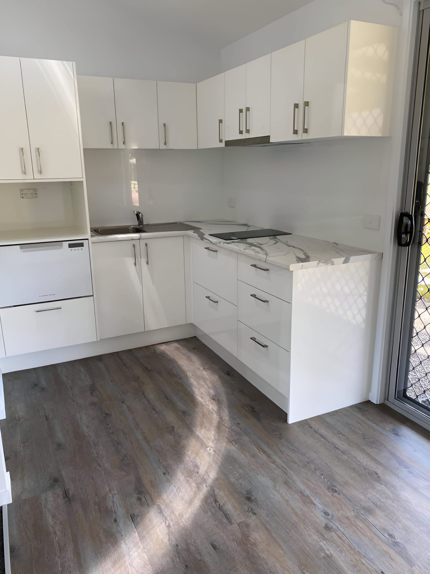 Modern Kitchen With Glossy White Cabinets — Piscopo Kitchens Plus In Forster, NSW